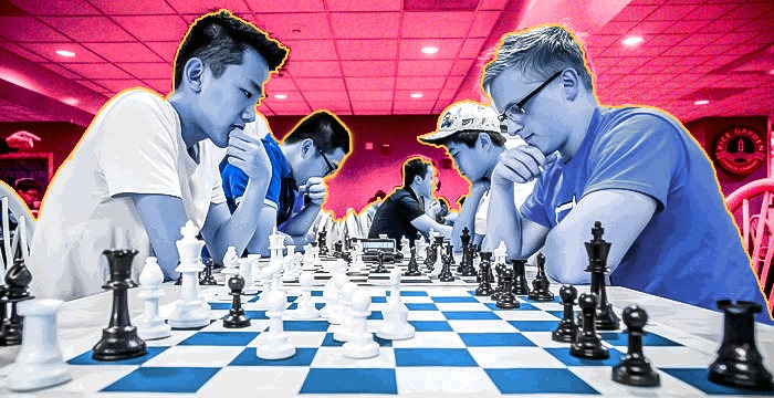Chess players in a chess tournament playing competitively
